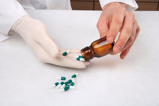 close up of hands and medicine pills