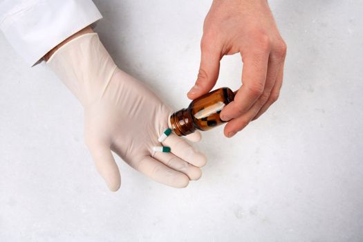 close up of hands and medicine pills