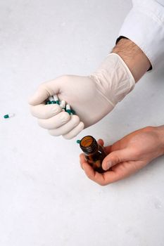 close up of hands and medicine pills