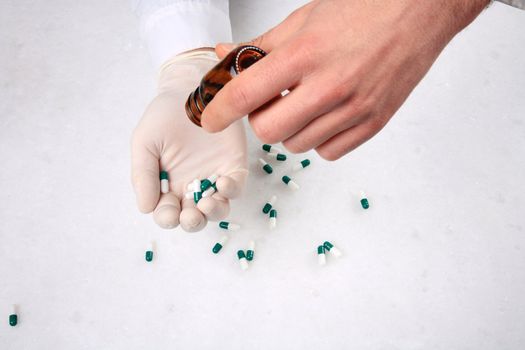 close up of hands and medicine pills