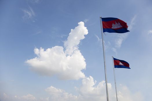 Two Cambodian flags waving under blue sky in Phnom Penh Cambodia