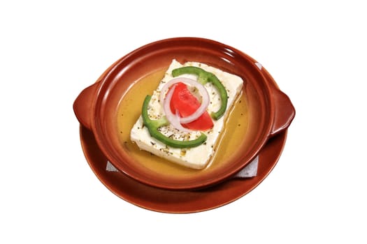 feta cheese with tomato onion pepper served on a plate