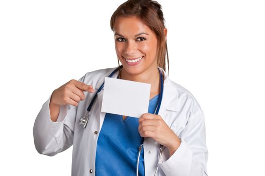 Young female doctor with a stethoscope holding a white card isolated in a white background