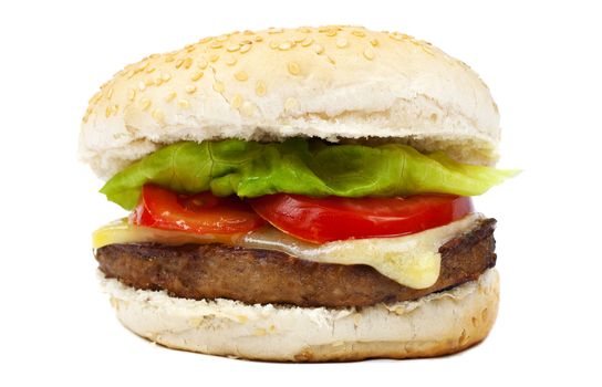 Hamburger containing cheese, lettuce and tomato.