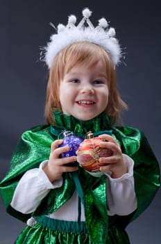 Little Princess over gray  background .girl  dressed in  suit