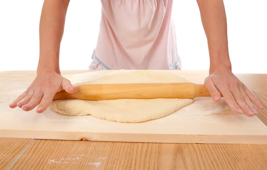 mix dough on the wooden board . Studio, white background. 