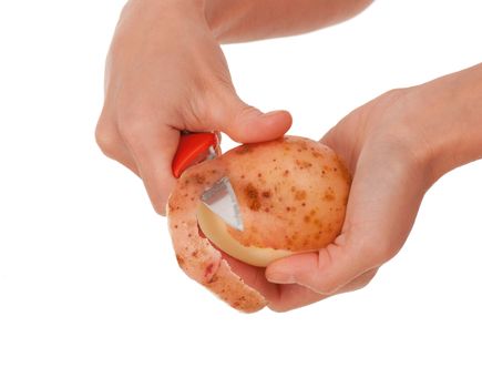 Hand holding knife peeling potato vegetable food .Studio, white background. 