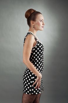 beautiful lady in a polka dot dress.  60s style 