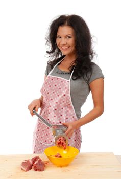 Meat Grinders  .beautiful housewife cutting meat. .Studio, white background. 