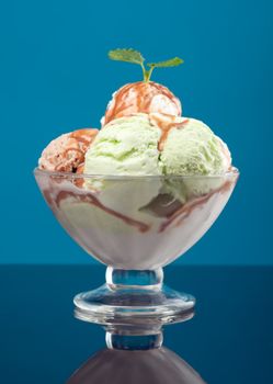 ice cream topped with syrup . closeup