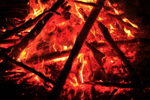 The sizzling core of a campfire with embers