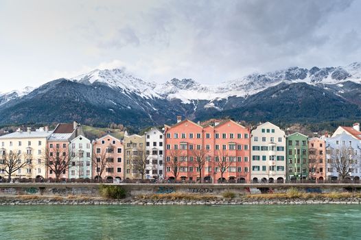 Row of Houses in Innsbruck, in the Background the austrian Alps