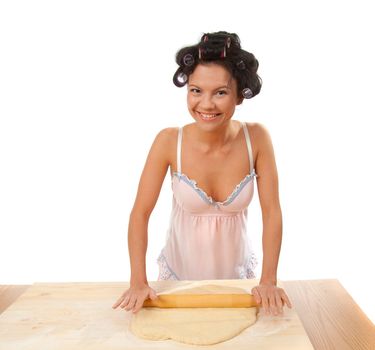  housewife mix dough on the wooden board.Studio, white background. 