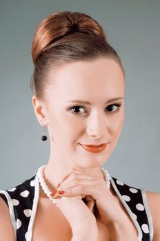Girl in american 60s style in  polka dot dress 