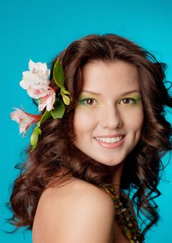 Sexy fashion portrait with flowers .Portrait of beautiful girl with flowers in her hair 