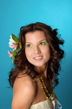 Portrait of beautiful girl with flowers in her hair 