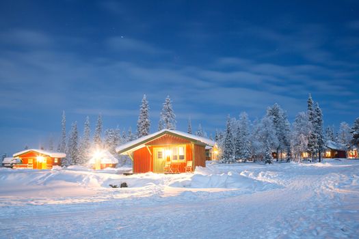 Winter landscape with cabin hut at night in Kiruna Sweden at Night with star trail