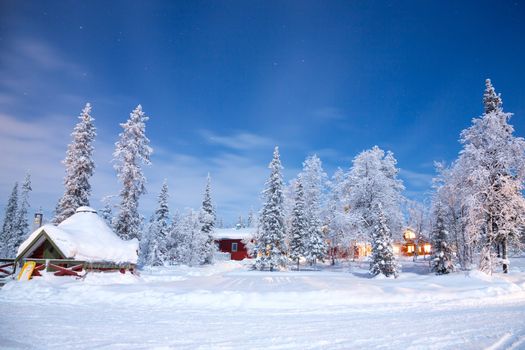 Winter landscape with cabin hut at night in Kiruna Sweden at Night with star trail