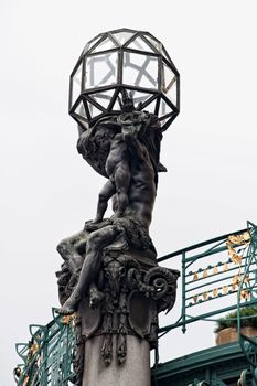 Art Nouveau sculpture at the top of a building in Prague