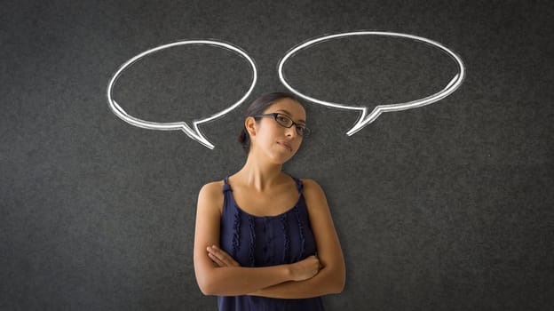 Woman standing in between two speech bubbles. 