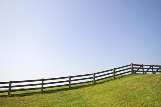 Fence and a blue sky in springtime