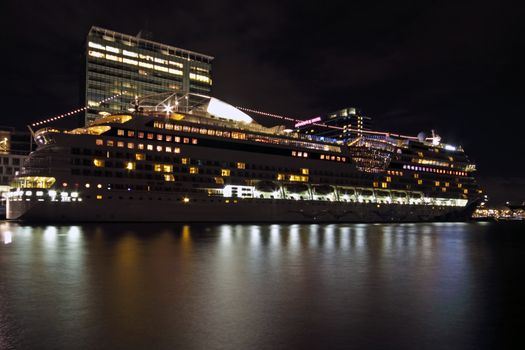 Cruise ship in the harbor from Amsterdam in the Netherlands by night