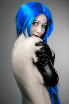 vogue style portrait of beautiful delicate woman with blue hair