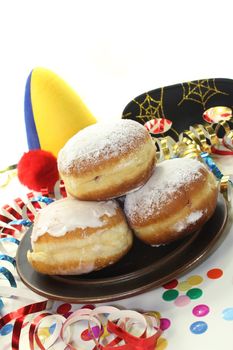 a plate of donuts and carnival decoration