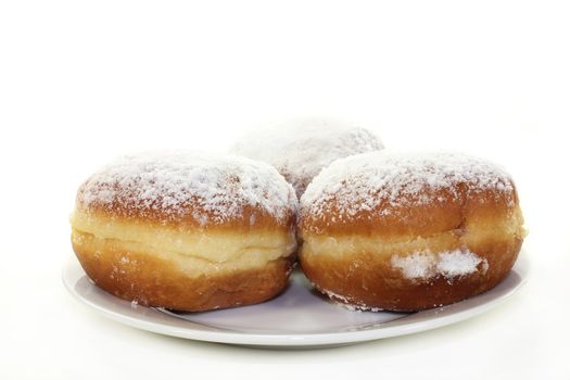 a plate of donuts on a white background