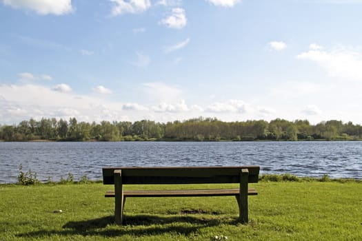 Bench at the water front from a lake