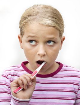 A child brushing teeth. Isolated on white
