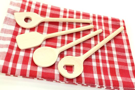 wooden cooking spoon on a checkered napkin