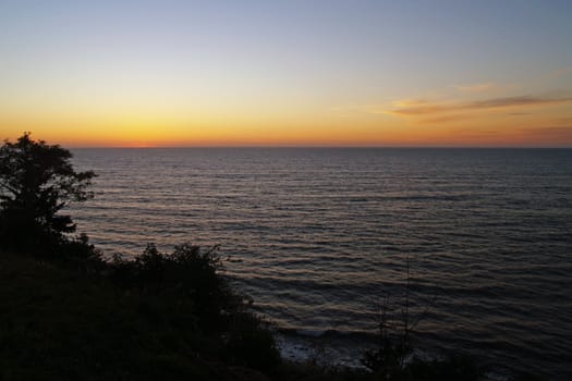 Golden Orange Sunset in a Clear Sky Over the Ocean