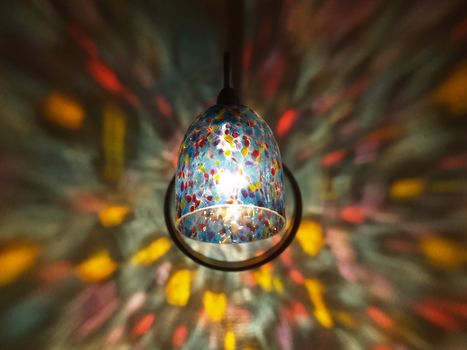 Lamp Lights in a Rainbow Sconce on a Wall