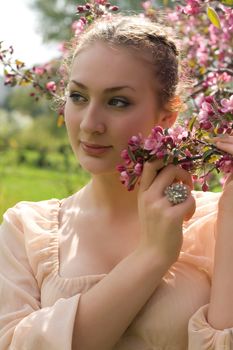 teen girl beautiful cheerful enjoying over spring Japanese cherry tree background