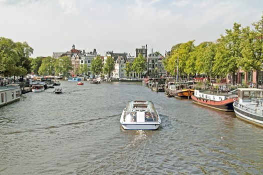 Sightseeing on the river Amstel in Amsterdam in the Netherlands