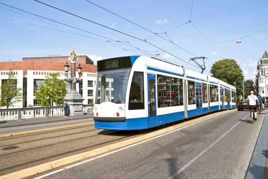 Tram driving in Amsterdam citycenter the Netherlands