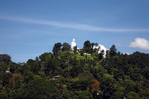 huge budha statue on top of the hill