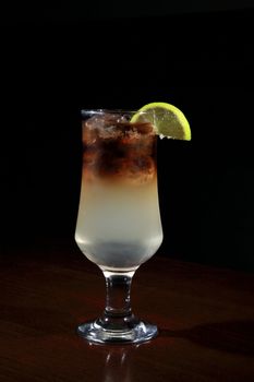 glass of Long Island cocktail on a bar