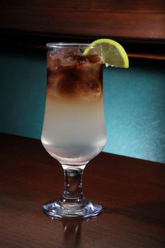 glass of Long Island cocktail on a bar