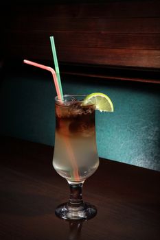 glass of Long Island cocktail on a bar