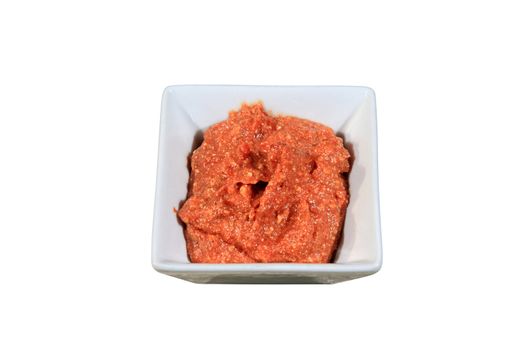 chilli sauce on a bowl isolated on a white background