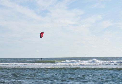 Kite Surfer out on the Ocean on a Sunny Day