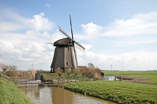traditional windmill in dutch landscape in the Netherlands