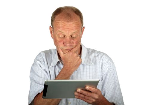 Concentrated man looking at his tablet computer