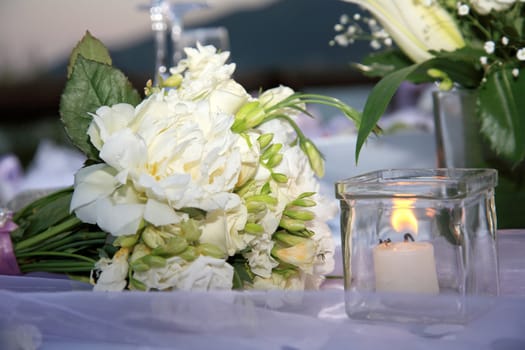 close up of wedding bouquet with white roses