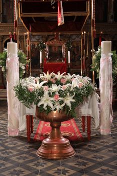 decoration with flowers on a christening bowl