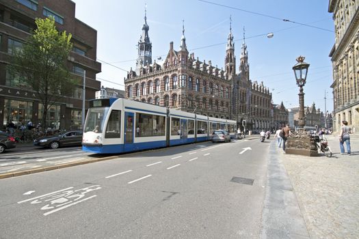 Tram driving in Amsterdam historical center in the Netherlands