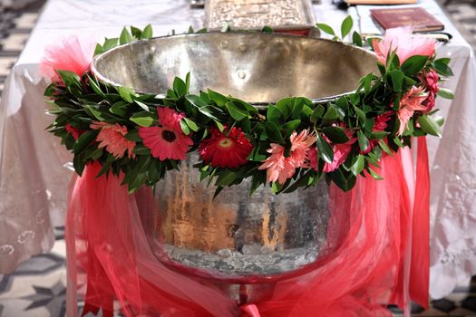 decoration with flowers on a christening bowl