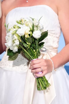 Bride holding bouquet of flowers at her wedding